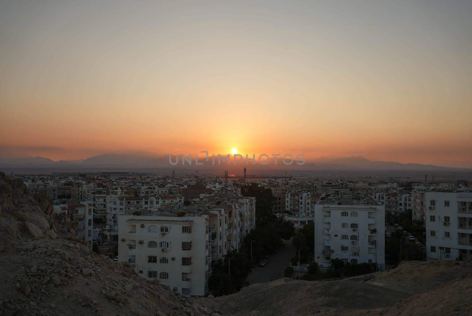 Sunset looking over an african city near the desert in Egypt. High quality photo