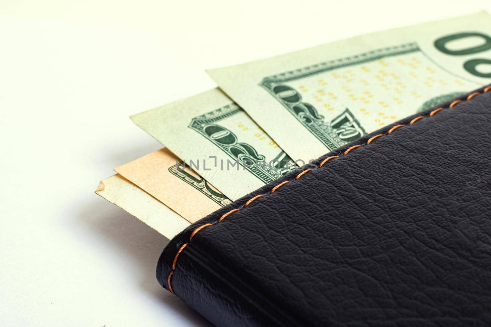 Dollars in wallet isolated on white background close up