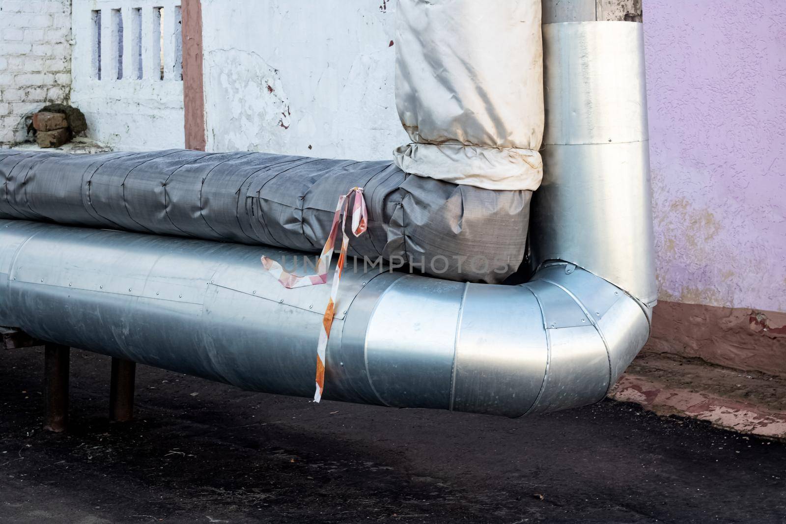 Large new metal water pipes close up under ground