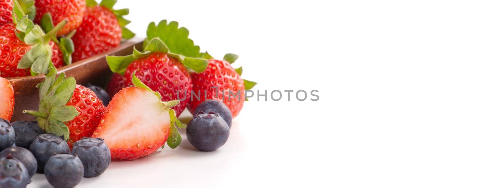 A bowl set of beautiful and delicious strawberry and blueberry isolated on white background, close up, copy space, clipping path, cut out.