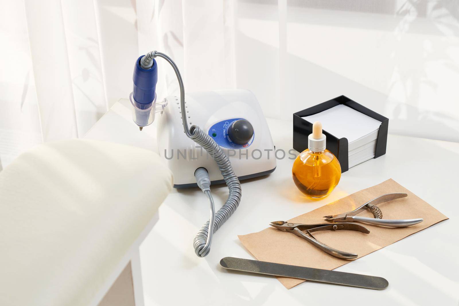 Manicure equipment. Set for home manicure and nail care. Manicure or pedicure set tools are placed on a table with a white towel in the beauty salon. Equipment for beauty shop or beauty parlour