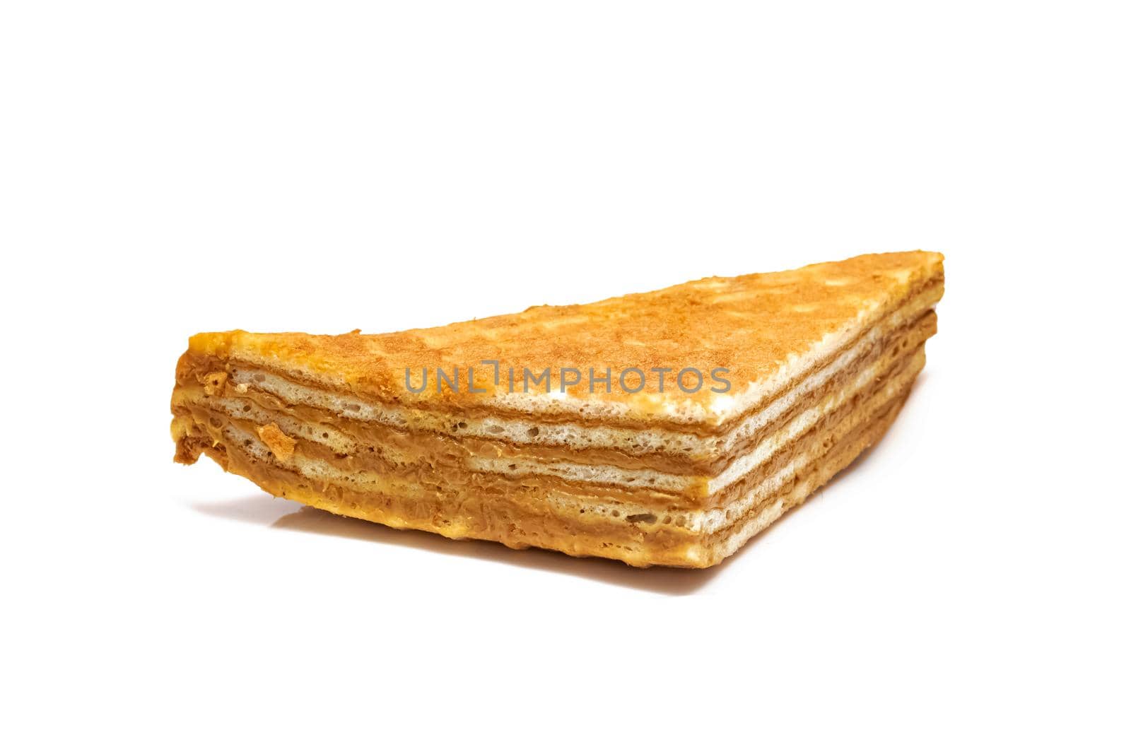 Waffles with condensed milk isolated on a white background