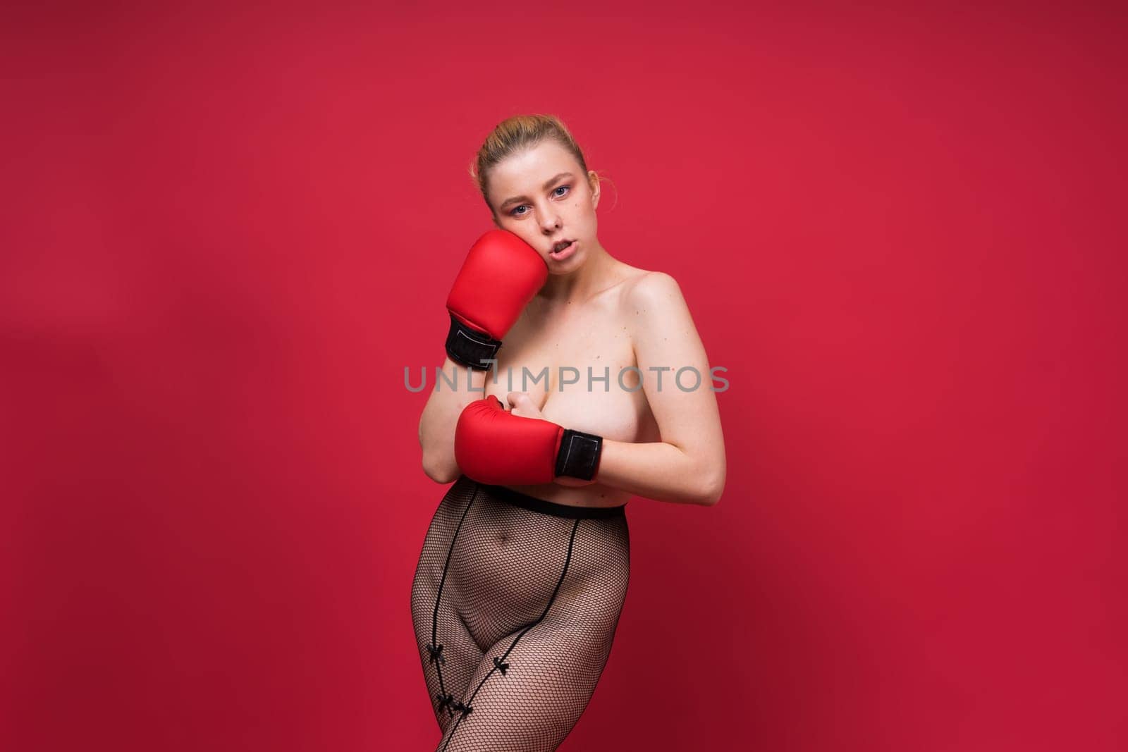 Boxer, seductive confident female boxer with gloves studio, sporty woman posing looking at camera. by Zelenin