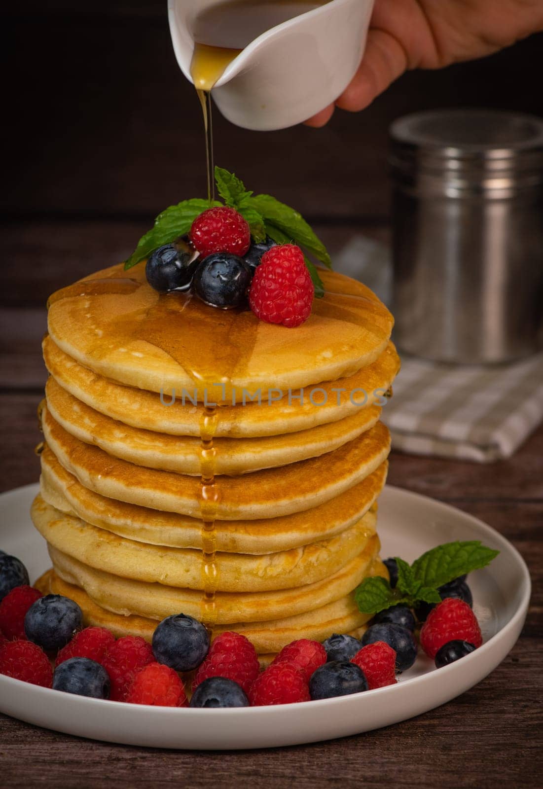 Recipe for maple syrup pancakes with raspberry and blueberry filling, High quality photo