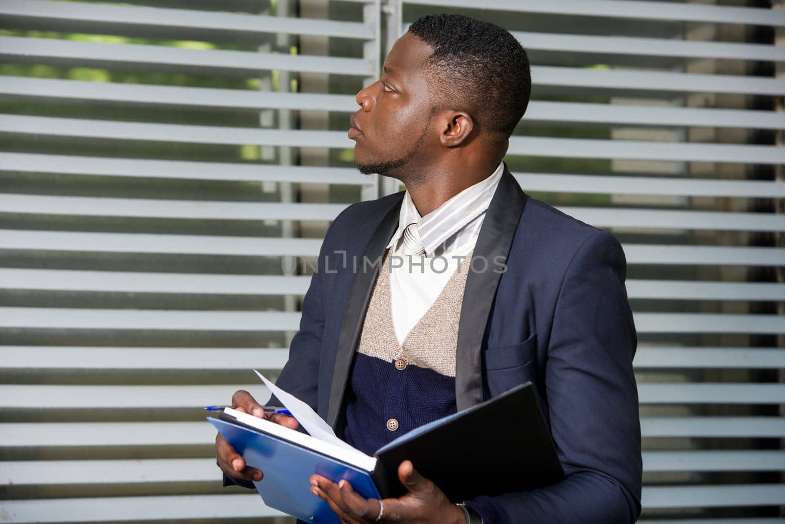 Portrait of businessman writing information on how to develop his project. Business people, industrial, investment concept.