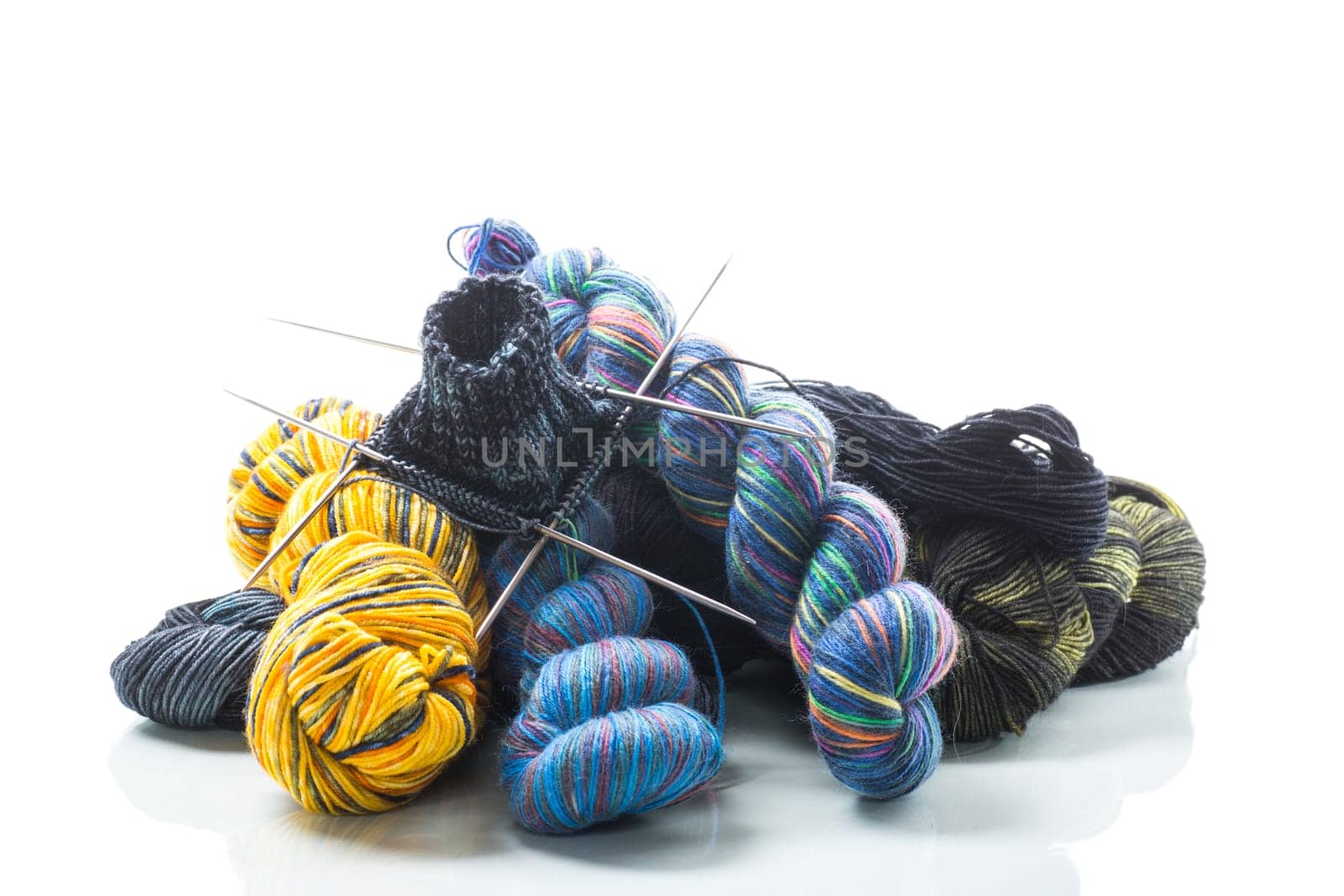 Colored threads, knitting needles and other items for hand knitting by Rawlik