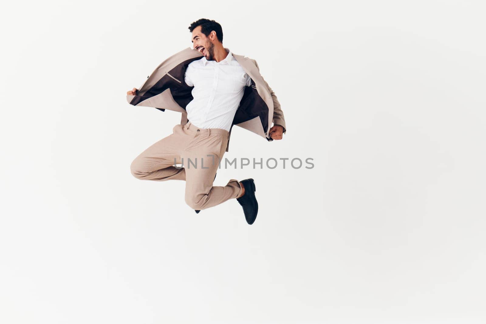 man winner victory businessman beige happy business suit running smiling sexy by SHOTPRIME