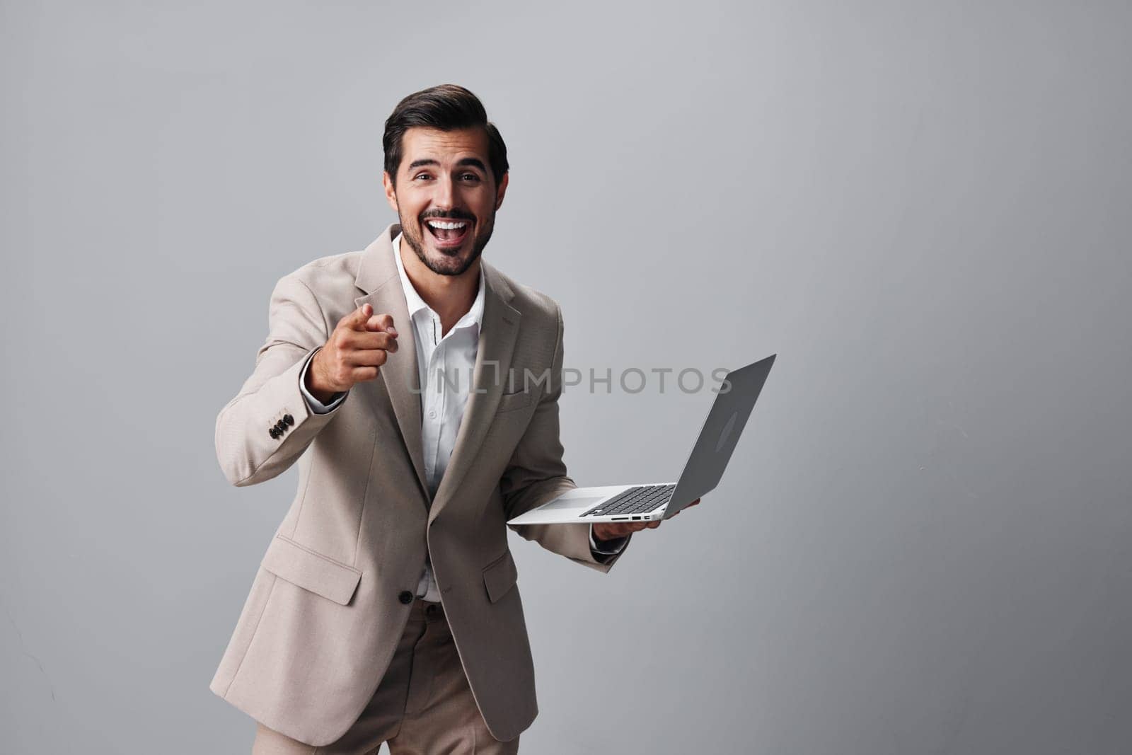 copyspace man white manager freelancer internet smiling cheerful portrait smile person computer job male suit business adult notebook laptop studio digital