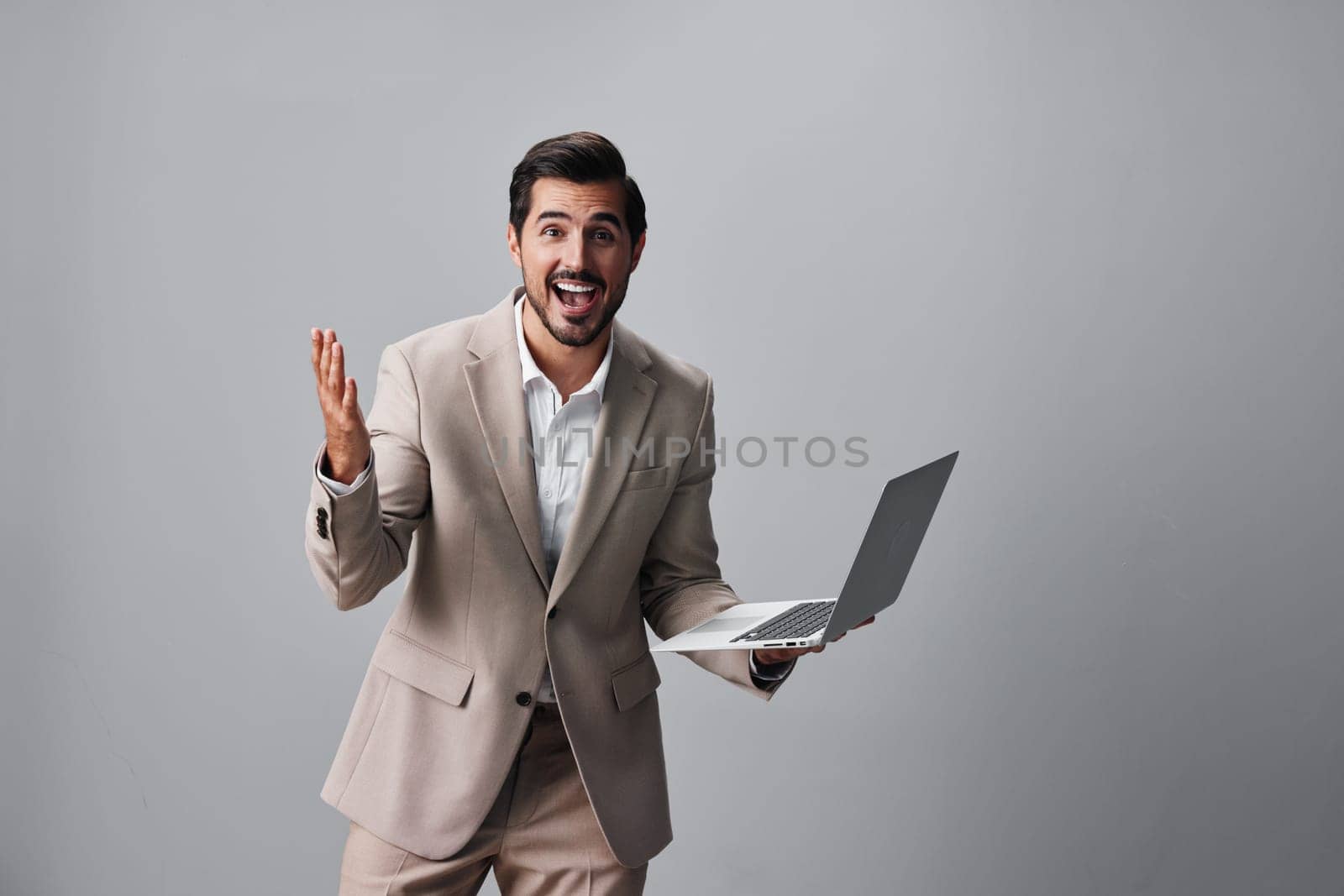 laptop man internet copyspace suit job freelancer computer happy business smiling by SHOTPRIME