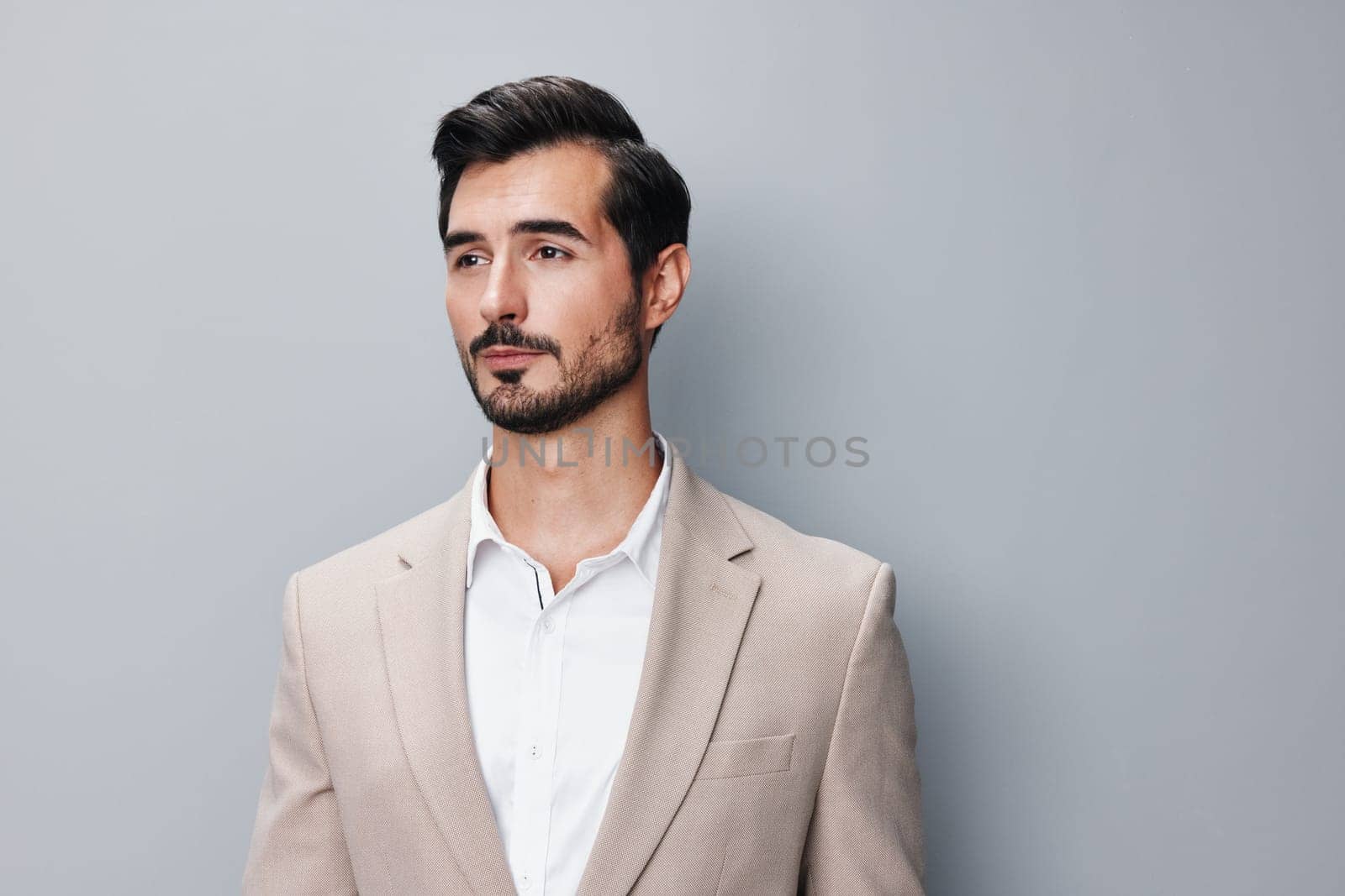 man suit business attractive folded male corporate copyspace happy executive crossed confident businessman handsome guy grey smiling successful person portrait beige