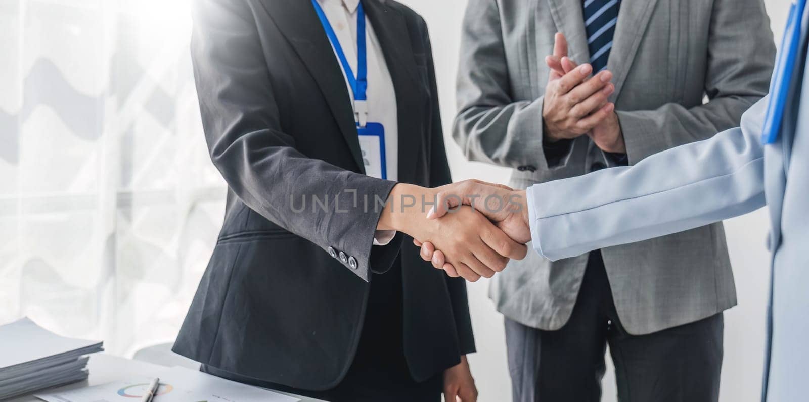 Business handshake for teamwork of business merger and acquisition,successful negotiate,hand shake,two businessman shake hand with partner to celebration partnership and business deal concept...