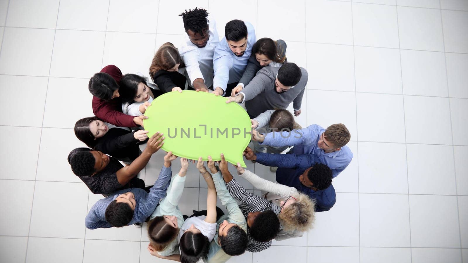 businessmen holding blank speech bubble above their heads. View from above