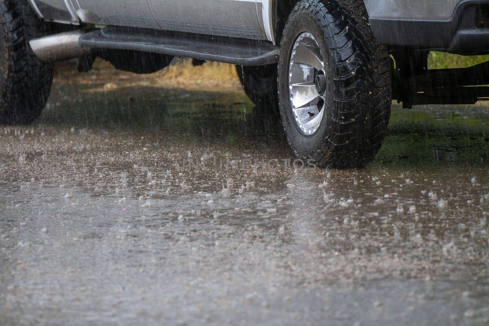 heavy rainfall and a pickup sitting in the rain