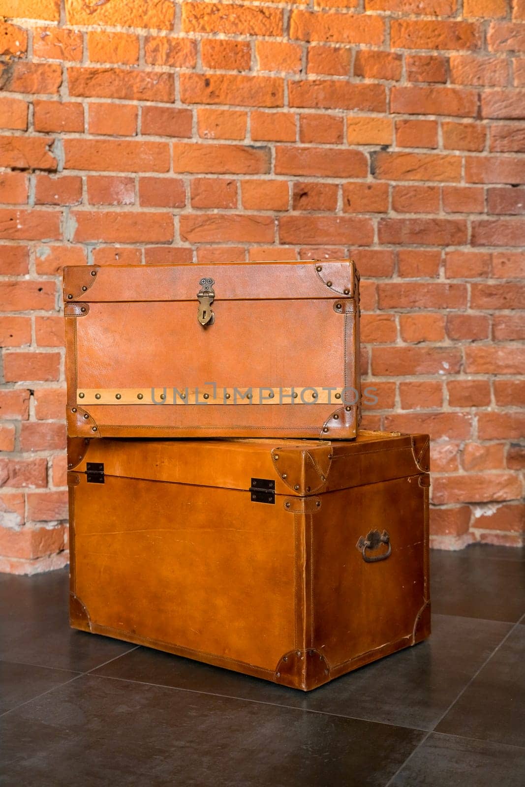 two retro decorative cases or storage boxes on a wooden rustic table