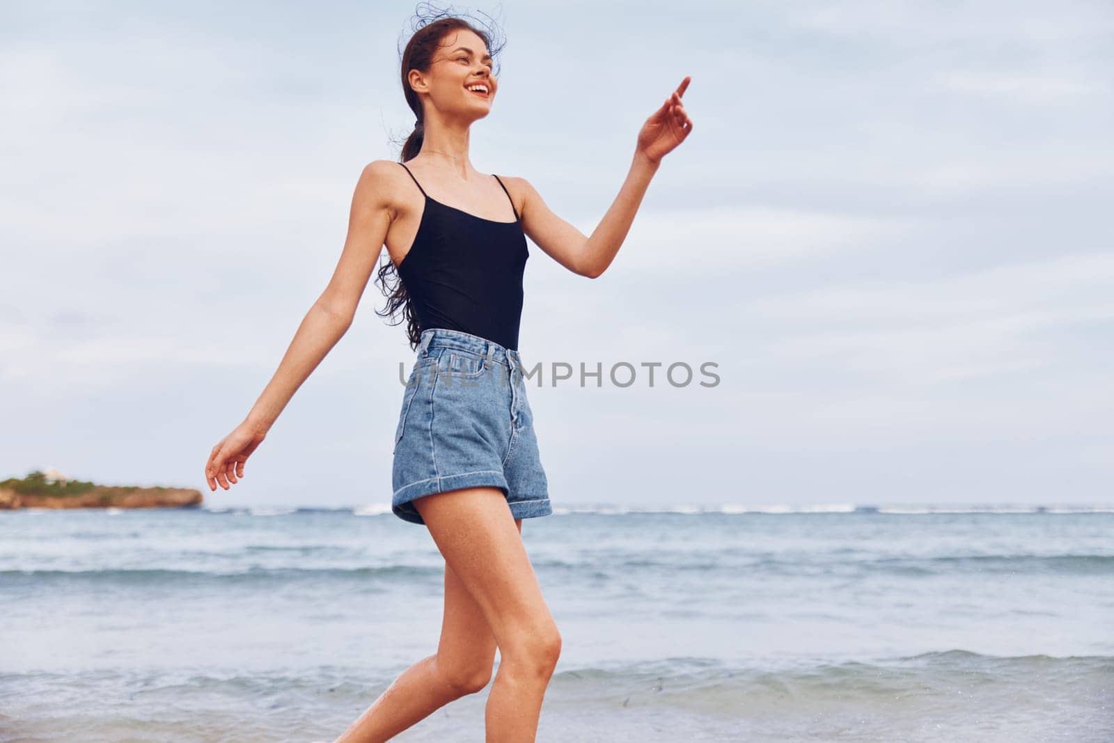 positive woman nature freedom sea lifestyle beach wave young smile running travel female summer shore sand sunset sun active smiling sexy