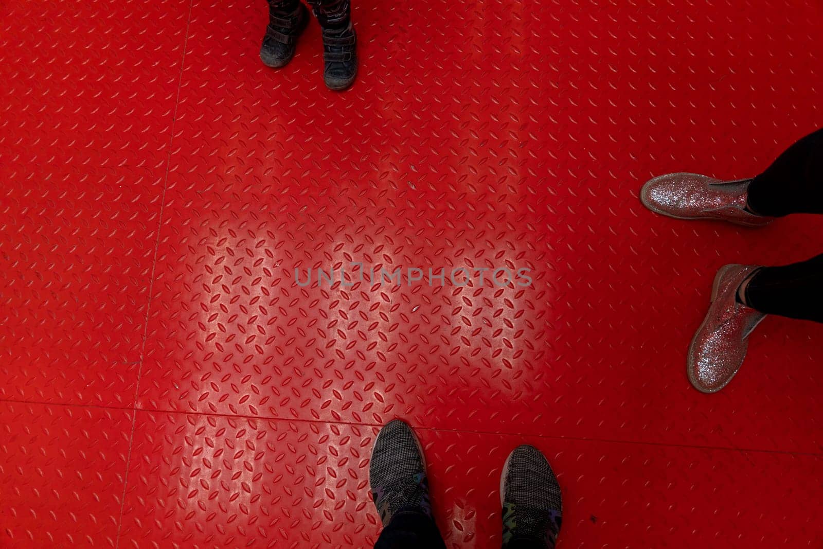 metal red painted surface floor view on feet. High quality photo