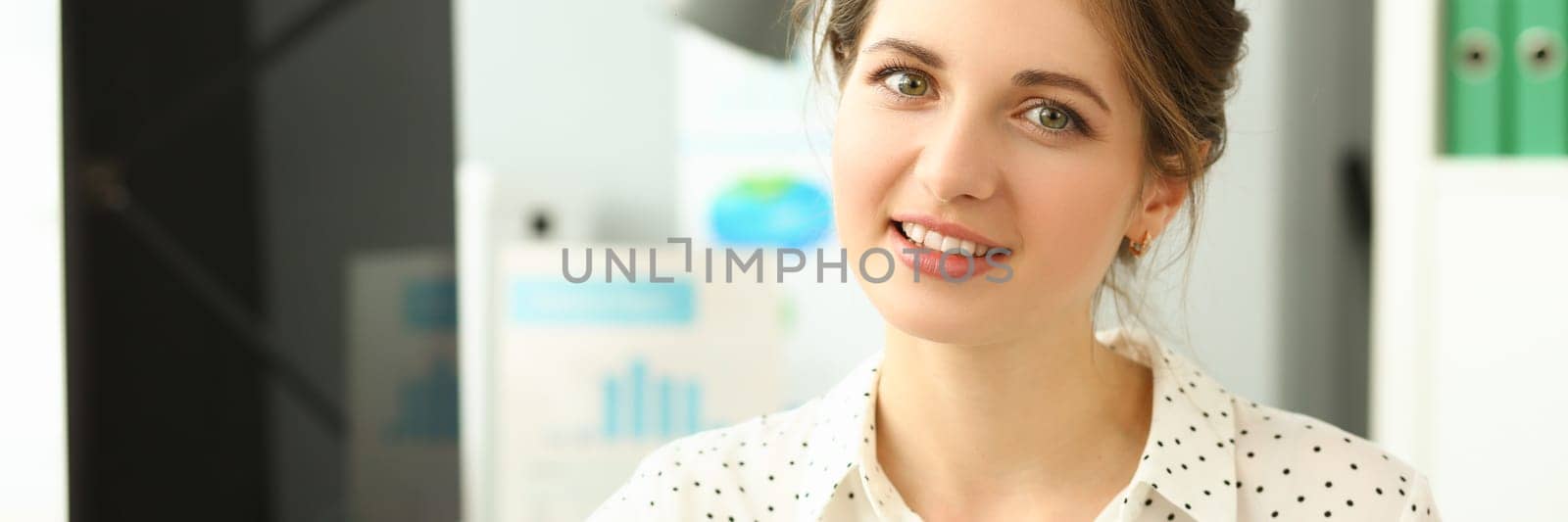 Portrait of beautiful young smiling business woman by kuprevich