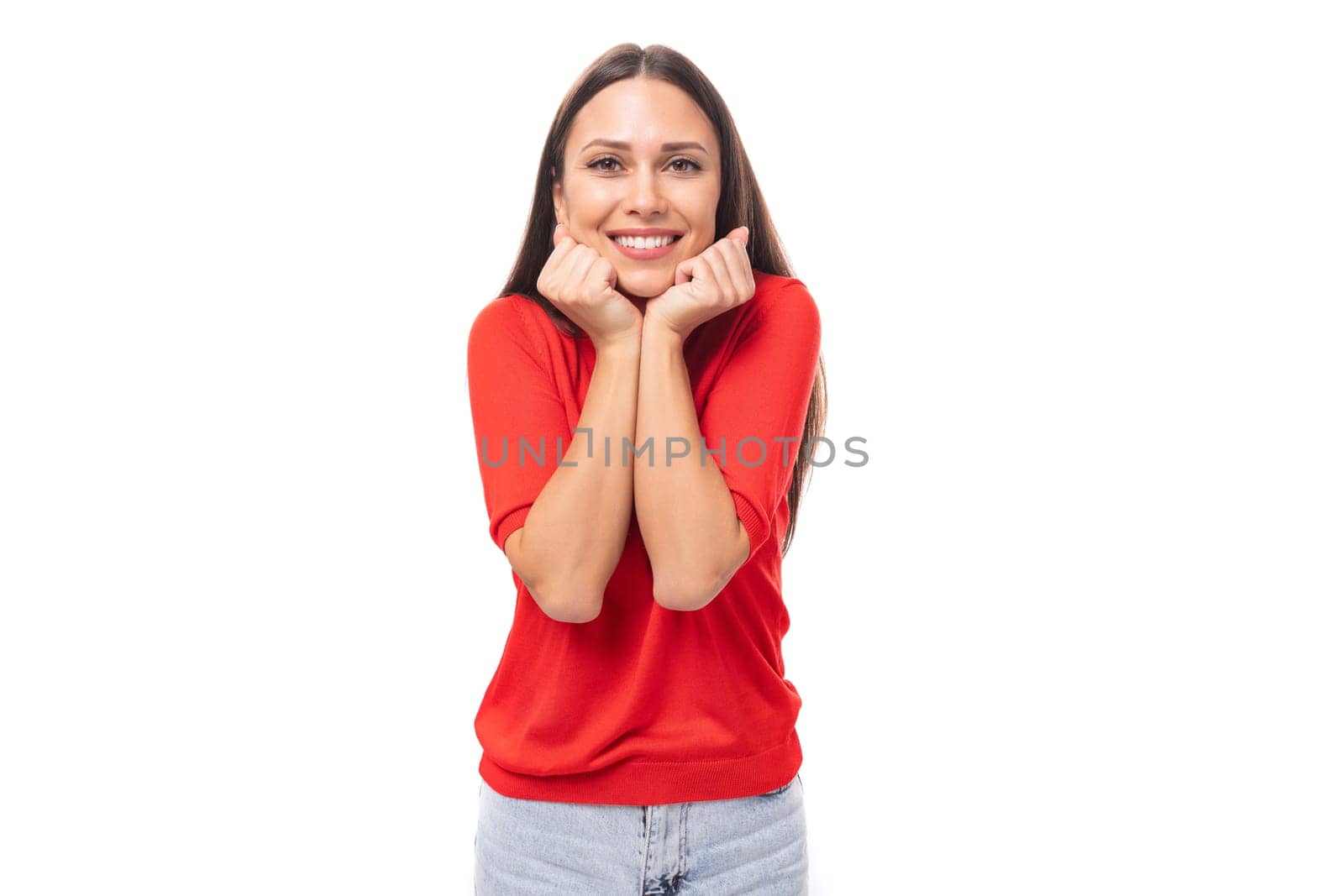 young charming european woman with black hair is dressed in a red t-shirt on a white background by TRMK