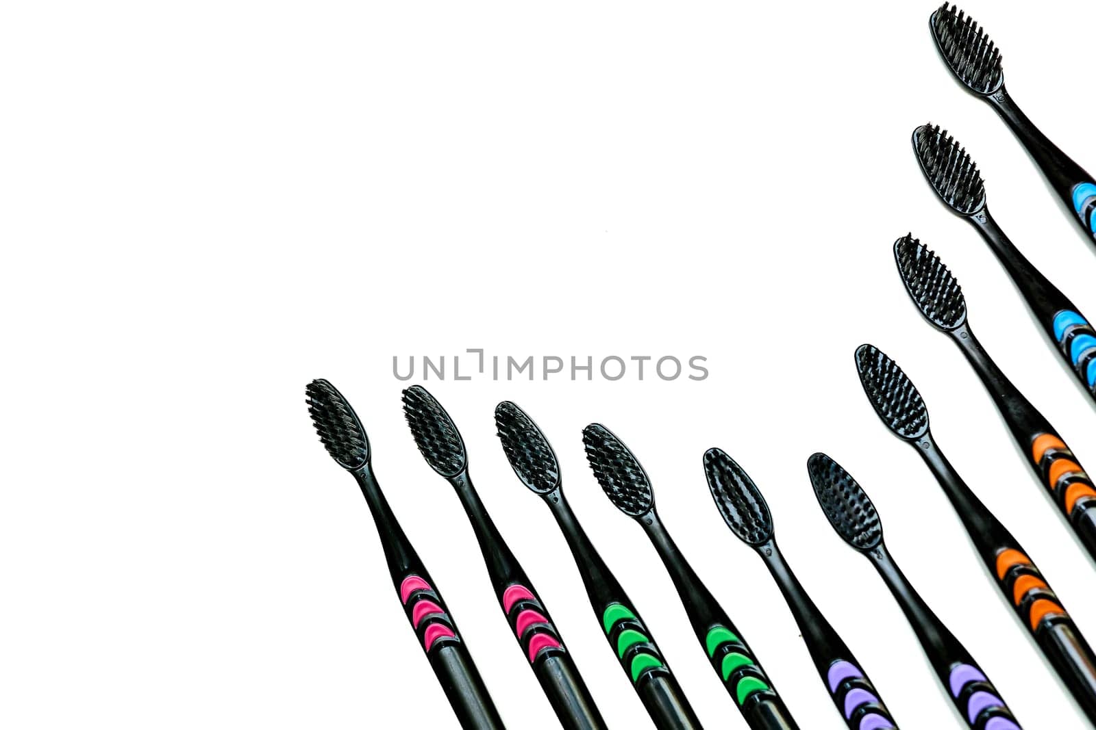 Black toothbrushes with colored inserts isolated on white.Design creativity by jovani68