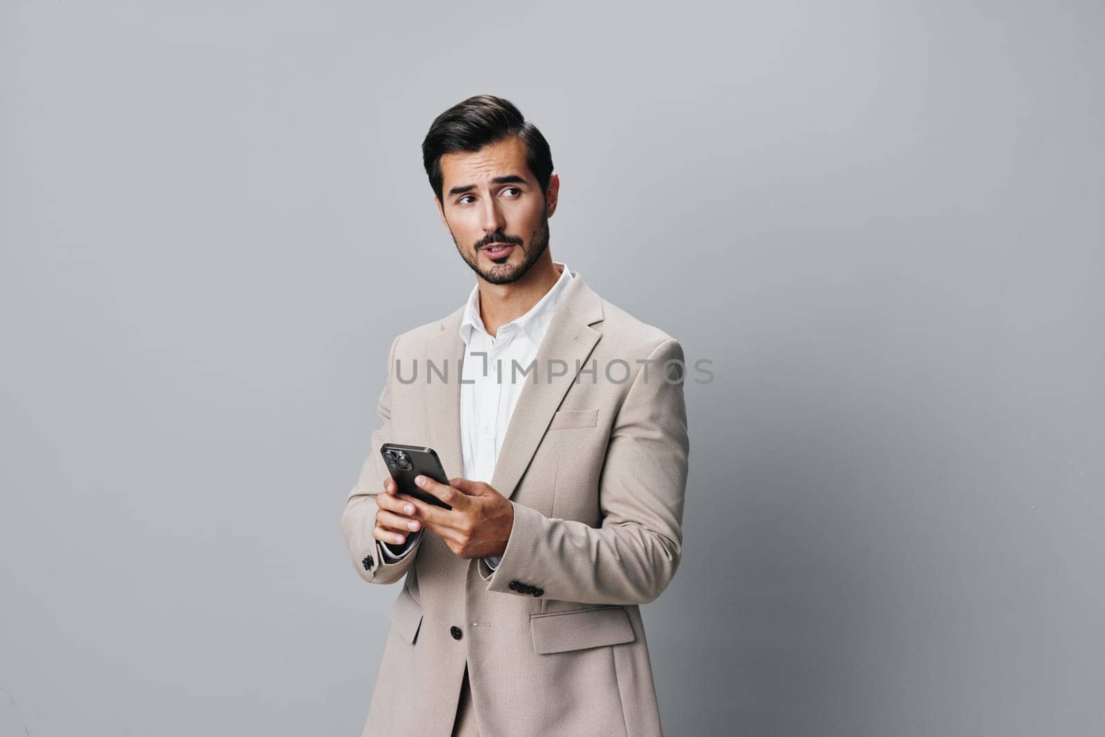 man hold portrait handsome app technology beard call confident connection communication business businessman selfies phone message smartphone happy cyberspace smile suit