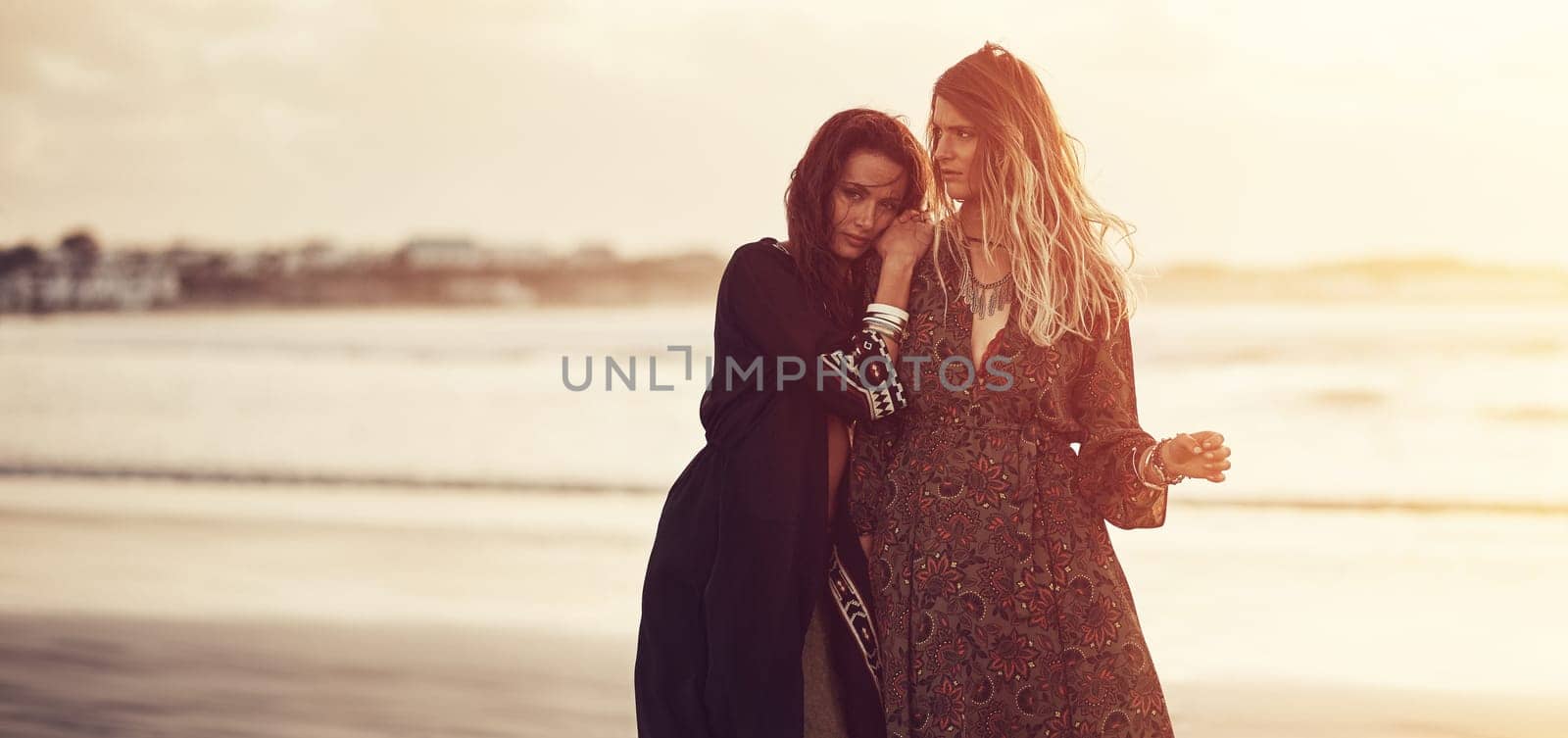 Be fearlessly authentic. two young women spending the day at the beach at sunset