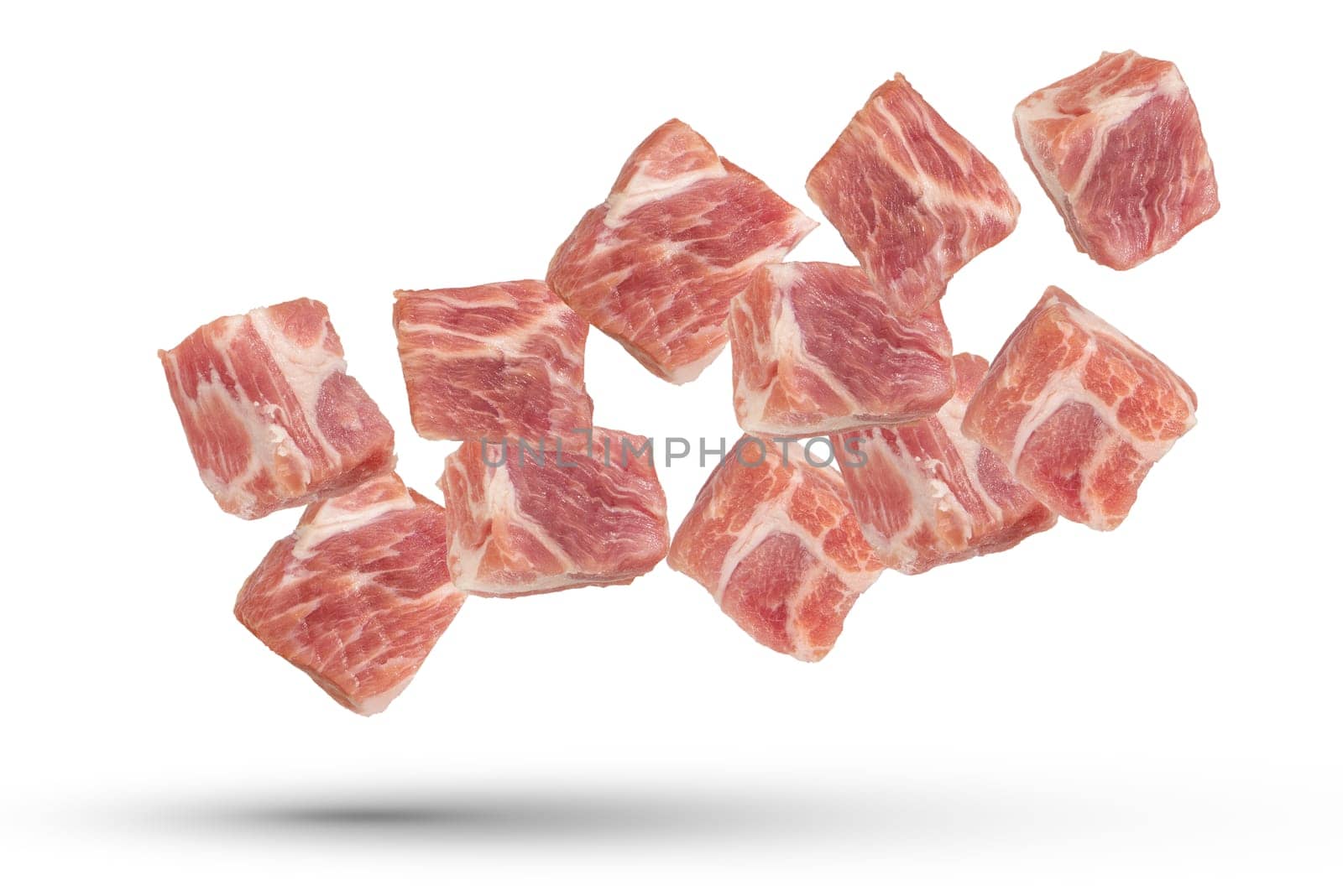 Raw pork cubes. Cubes of pieces of pork scatter in different directions, isolated on a white background. Isolate cubes of juicy pork for inserting into a design or project. by SERSOL