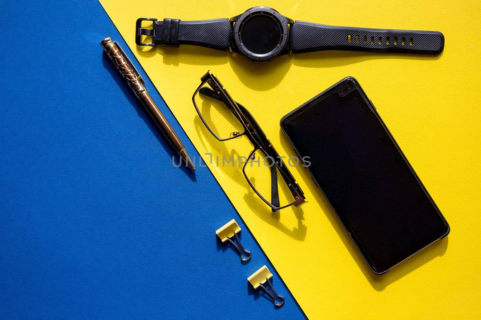 Outfit of traveler, businessman or student. Smartphone, sleep mask, glasses, watch, mp3 player