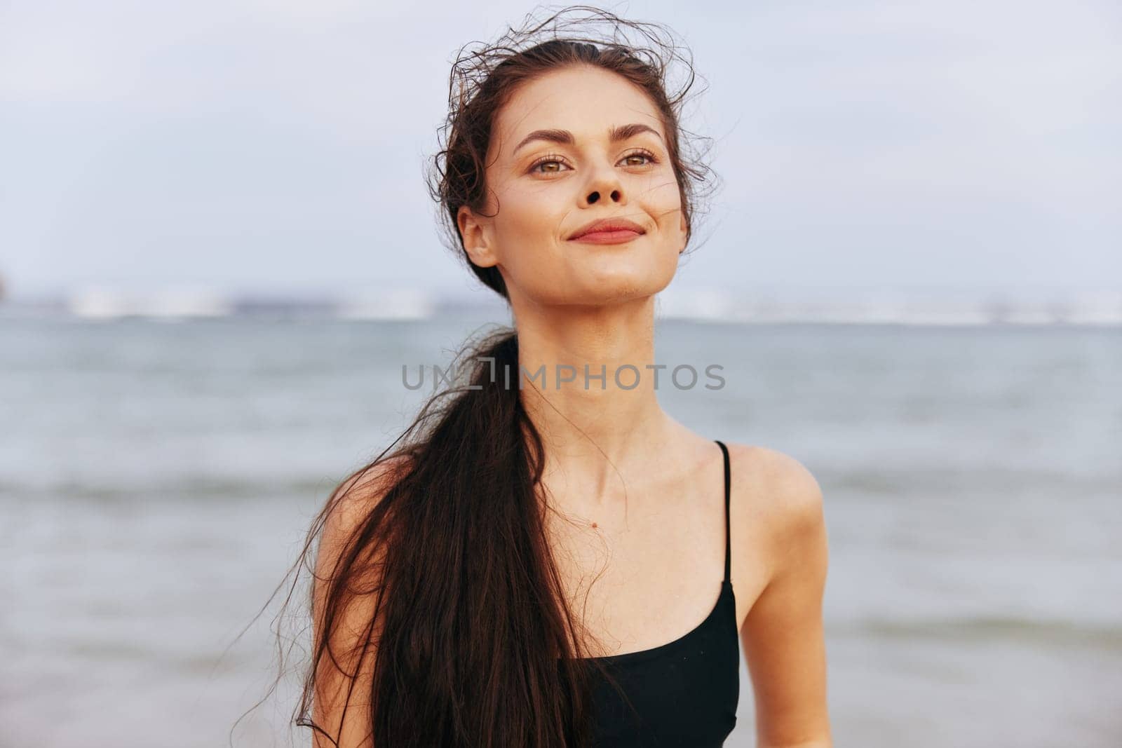 peaceful woman ocean dress beach copy-space happy carefree vacation space summer travel copy leisure smile sea shore sunset free sand smiling lifestyle