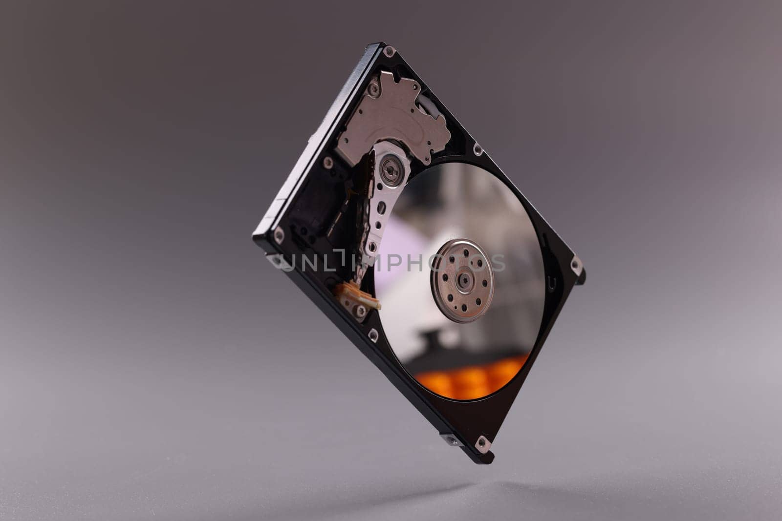 Closeup of hardware of internal mechanism of hard drive. Computer parts and hard drive selection concept