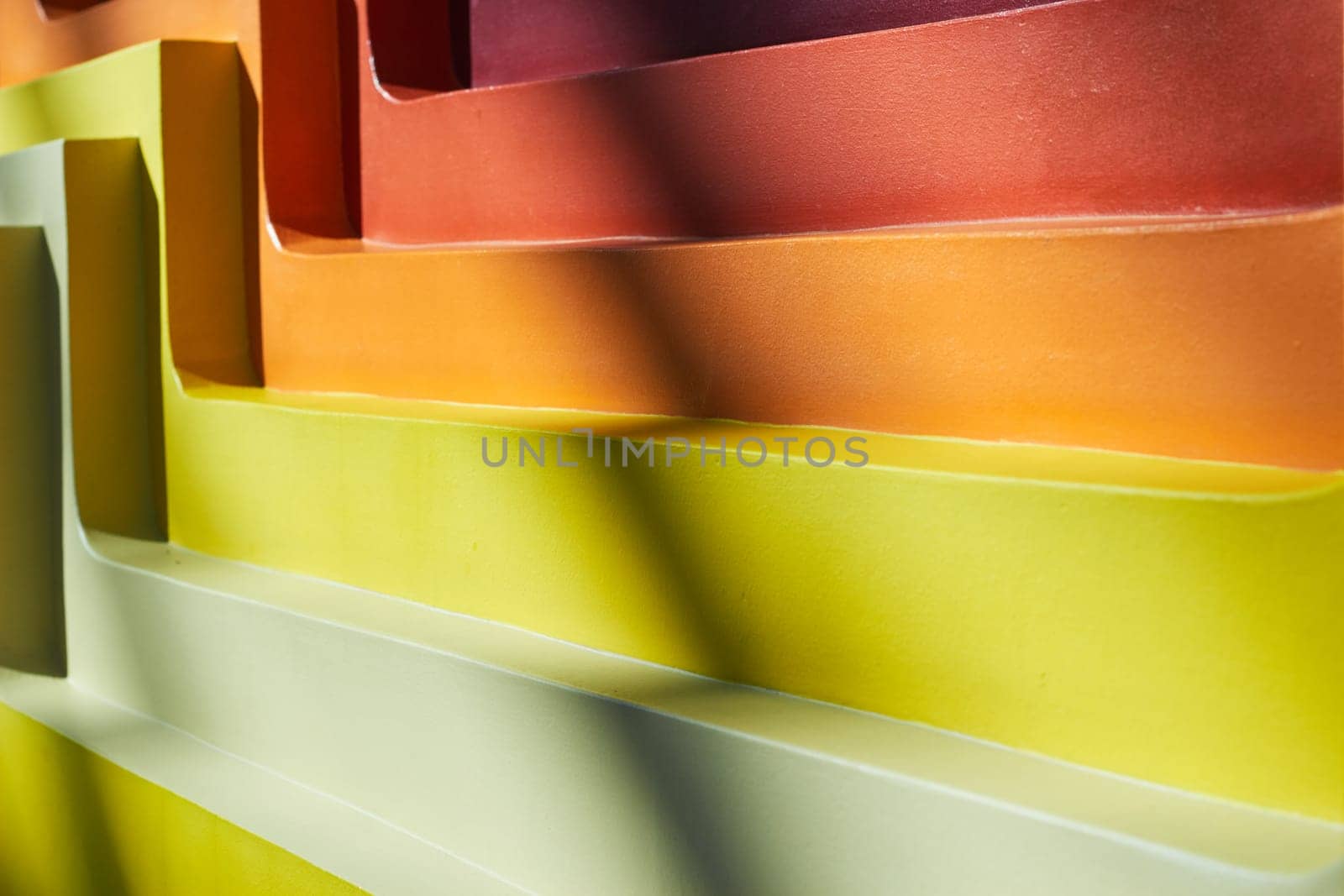 Abstract background multicolored staircase steps with falling shadow. The interior of the trading floor. Wall.