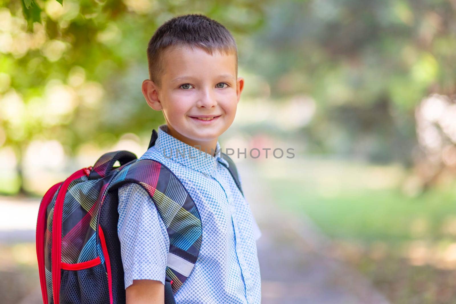 Back to school. A little boy goes to school on the day of the beginning of the term. Beginning of lessons.