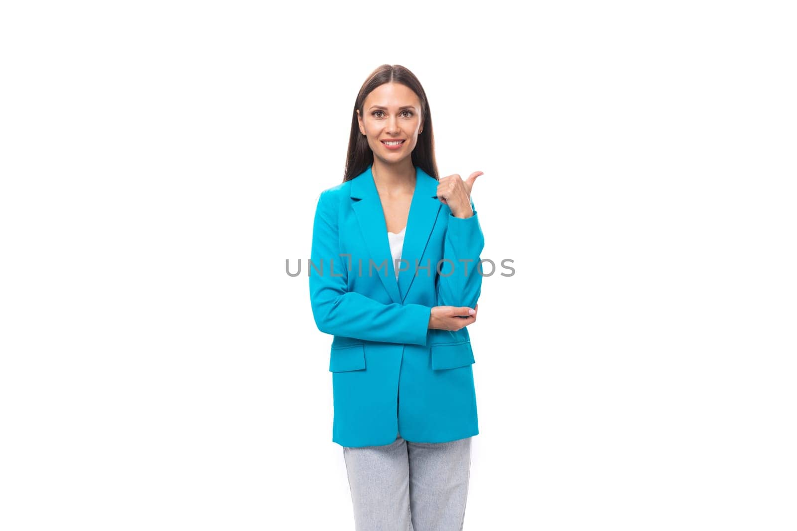 young brunette woman secretary in a blue elegant jacket on a white background with copy space.