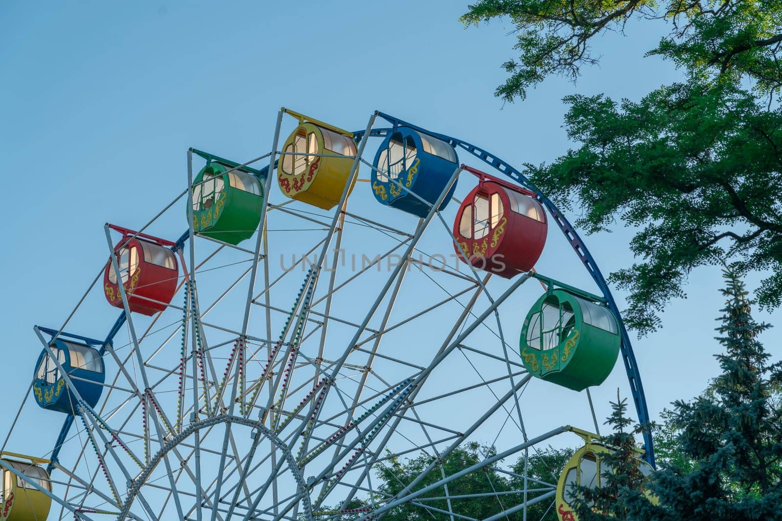 Ferris wheel on a blue sky background. photo