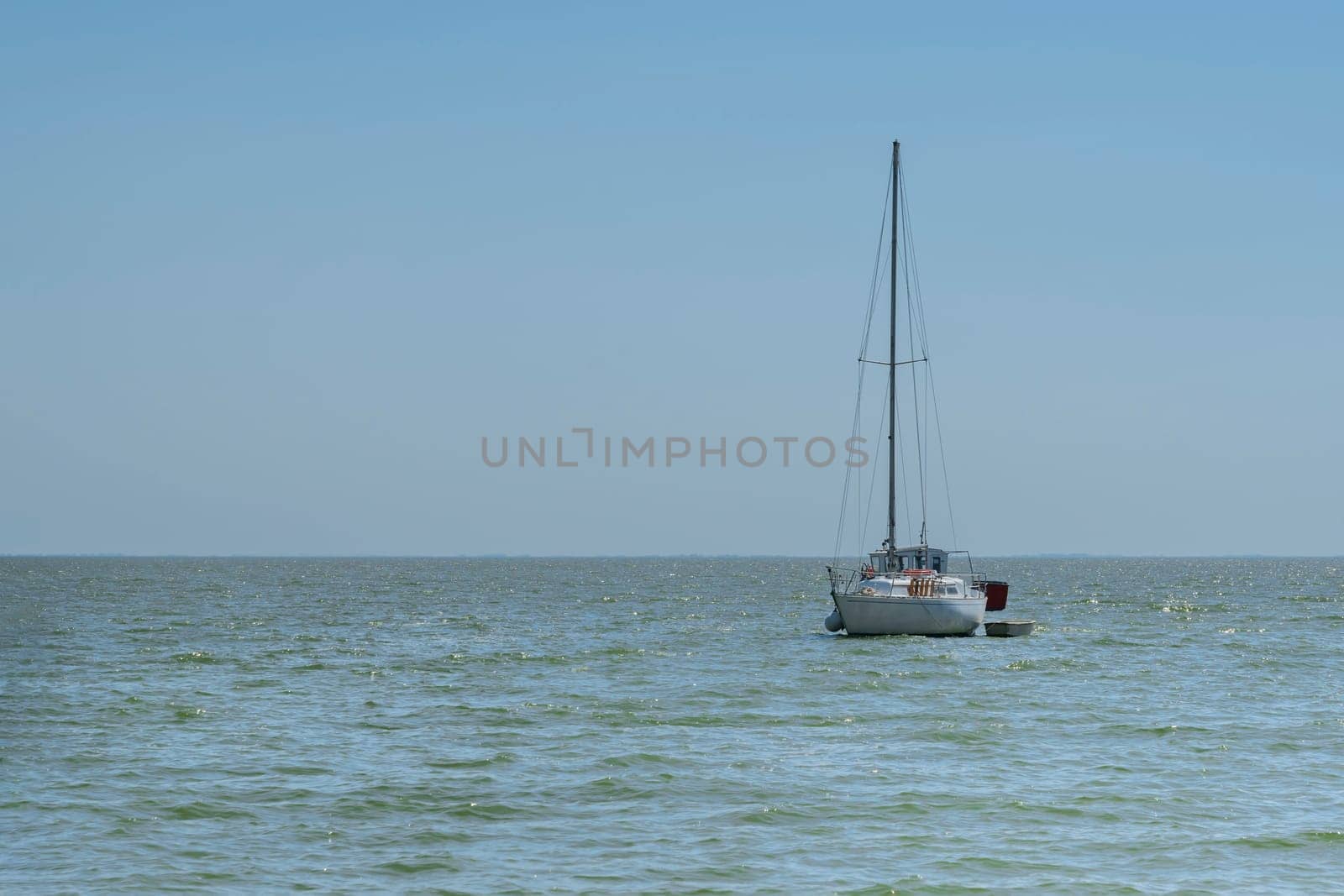 yachts on the water against the blue sky. photo