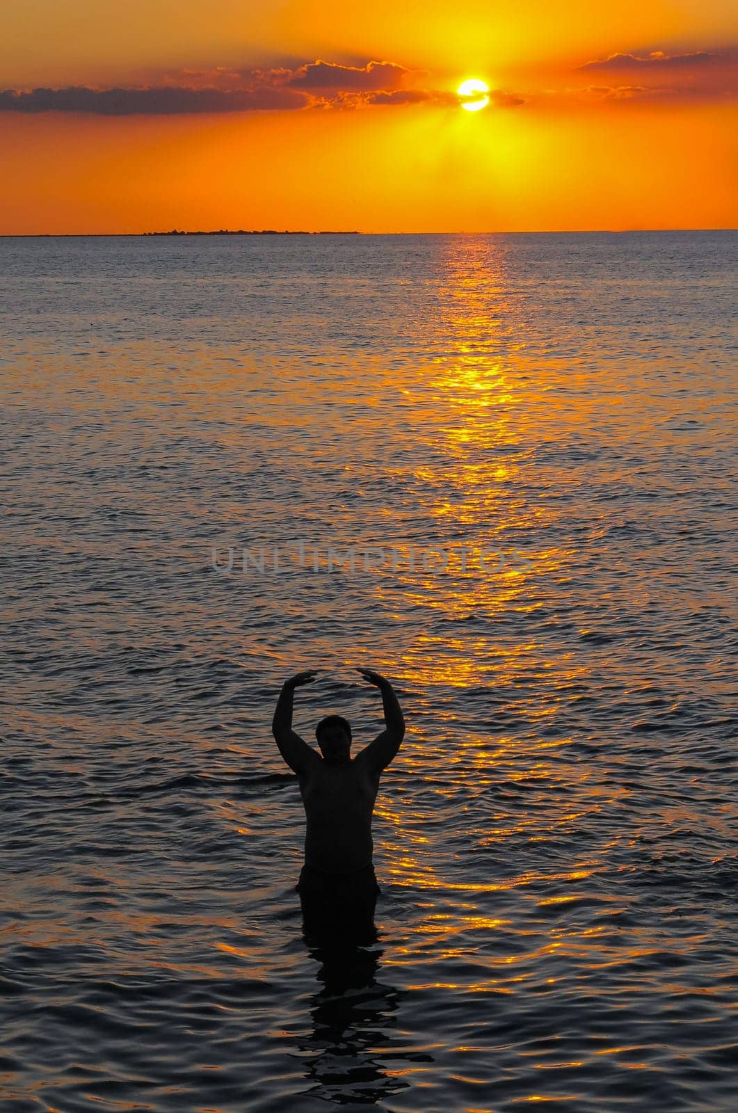 Human silhouette against the background of the sunrise over the Black Sea in the Eastern Crimea by Hydrobiolog