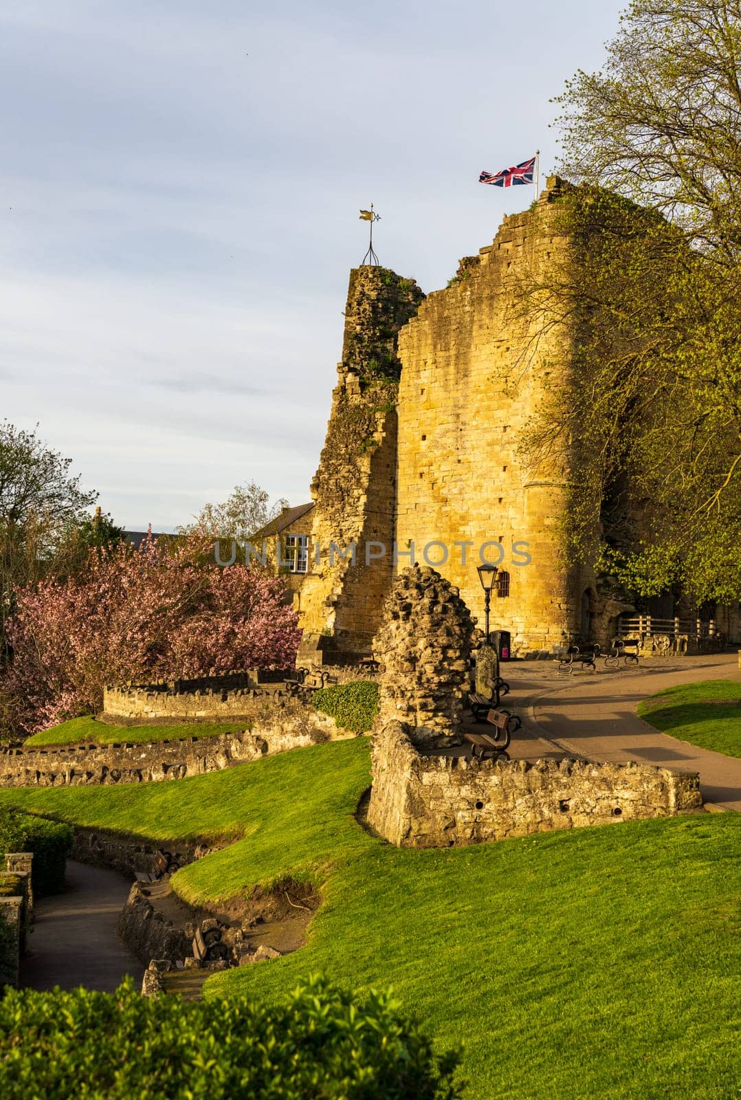 Ancient stone castle walls with keep overlooking river in Knaresborough near Harrogate in Yorkshire