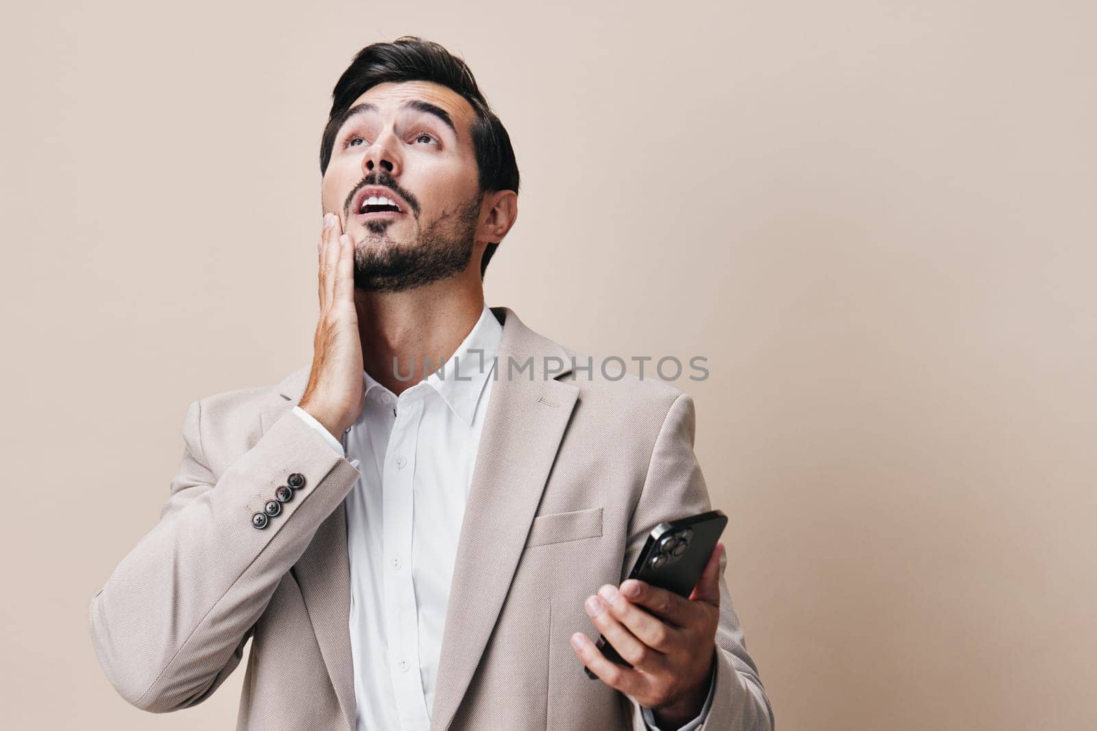 man smartphone communication happy call smile portrait business suit phone hold by SHOTPRIME