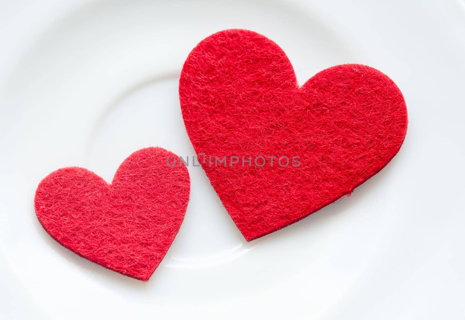 Red hearts on a plate close-up. Valentine's Day.