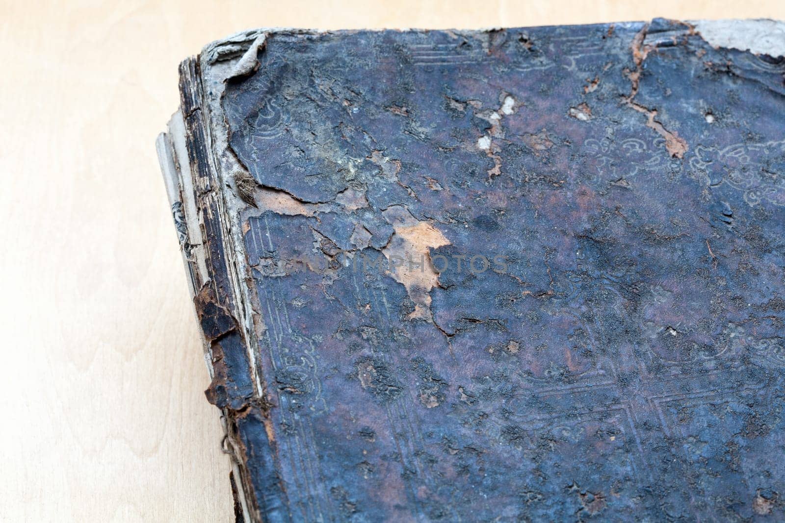 Ancient book close-up, on white background. Selective focus