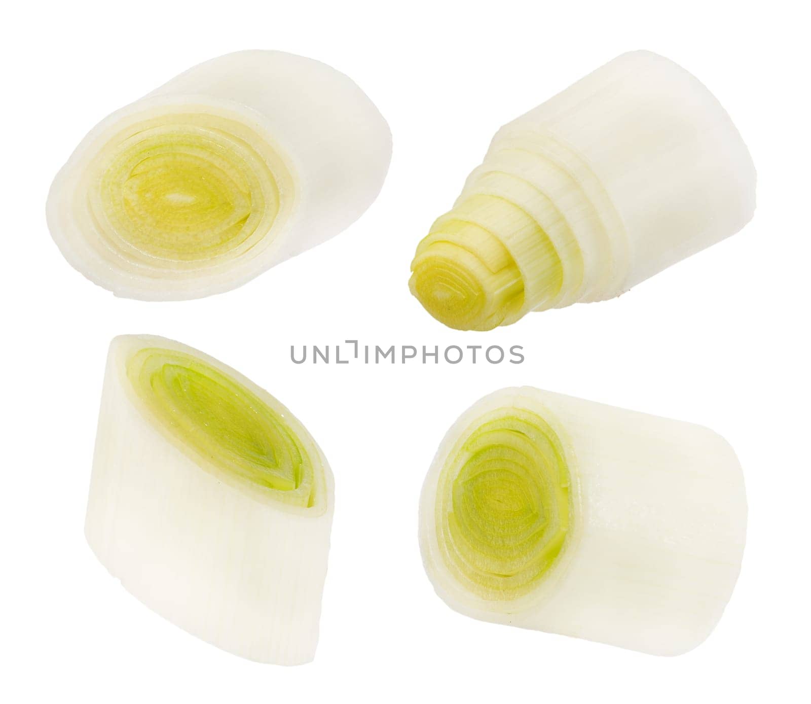 Leek slices. White and green onion slices isolated on white background. A group of leek slices of different sizes. by SERSOL