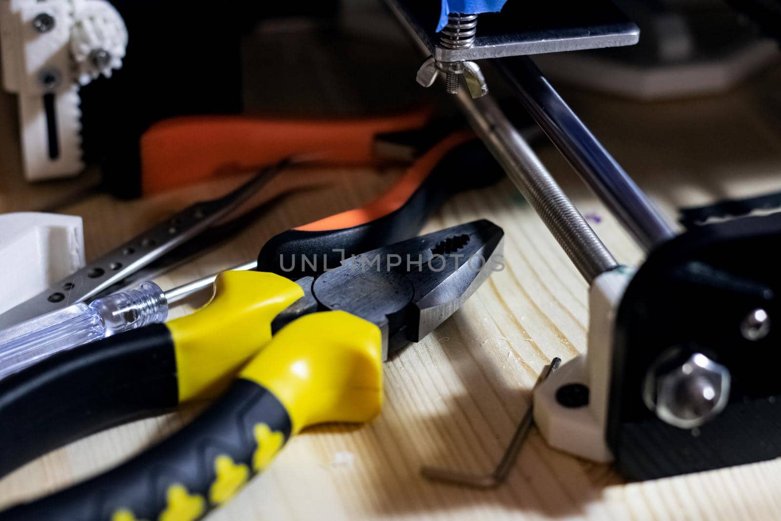 Tools in a workshop on a wooden table close up