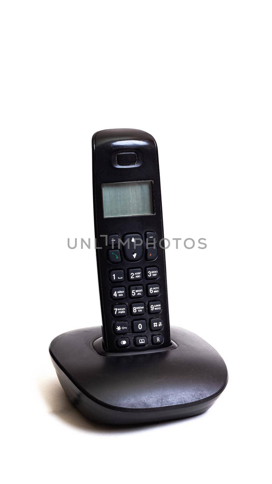 Old handset of cordless landline phone isolated on a white background close up