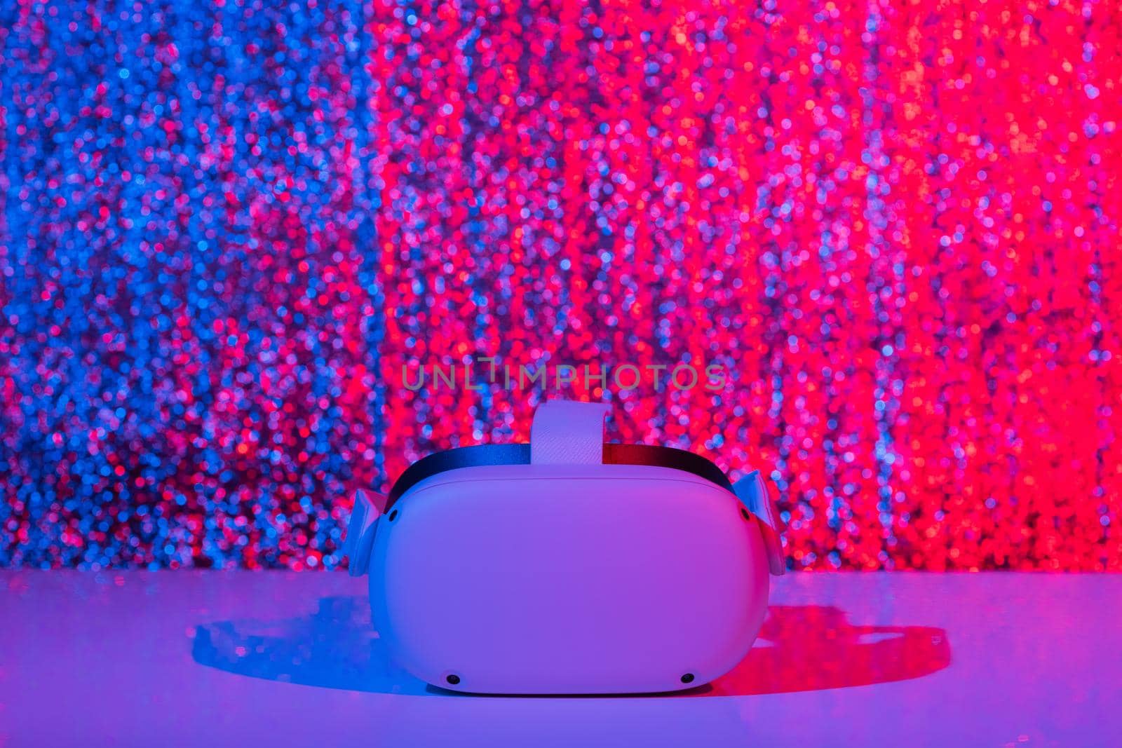 Virtual reality helmet on white background in neon light. VR technology concept. by galinasharapova