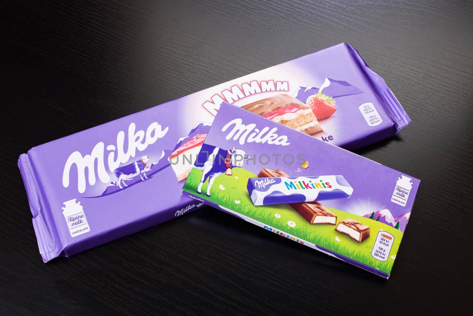 BELARUS, NOVOPOLOTSK - 20 DECEMBER, 2020: Milka chocolate close up on wooden table