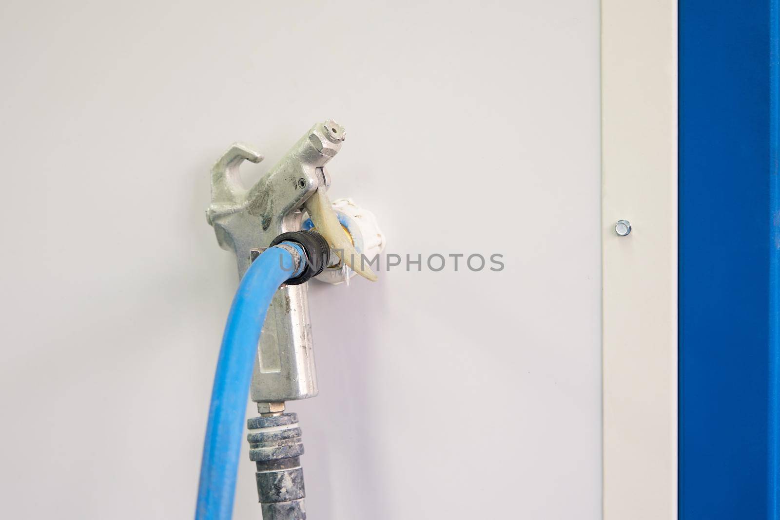 airbrush for car painting, spray gun or pistol in auto repair shop