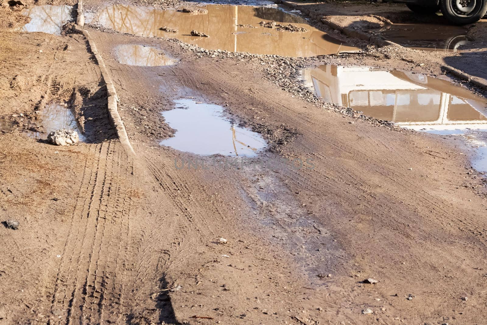 Puddles and mud on a sandy road by Vera1703