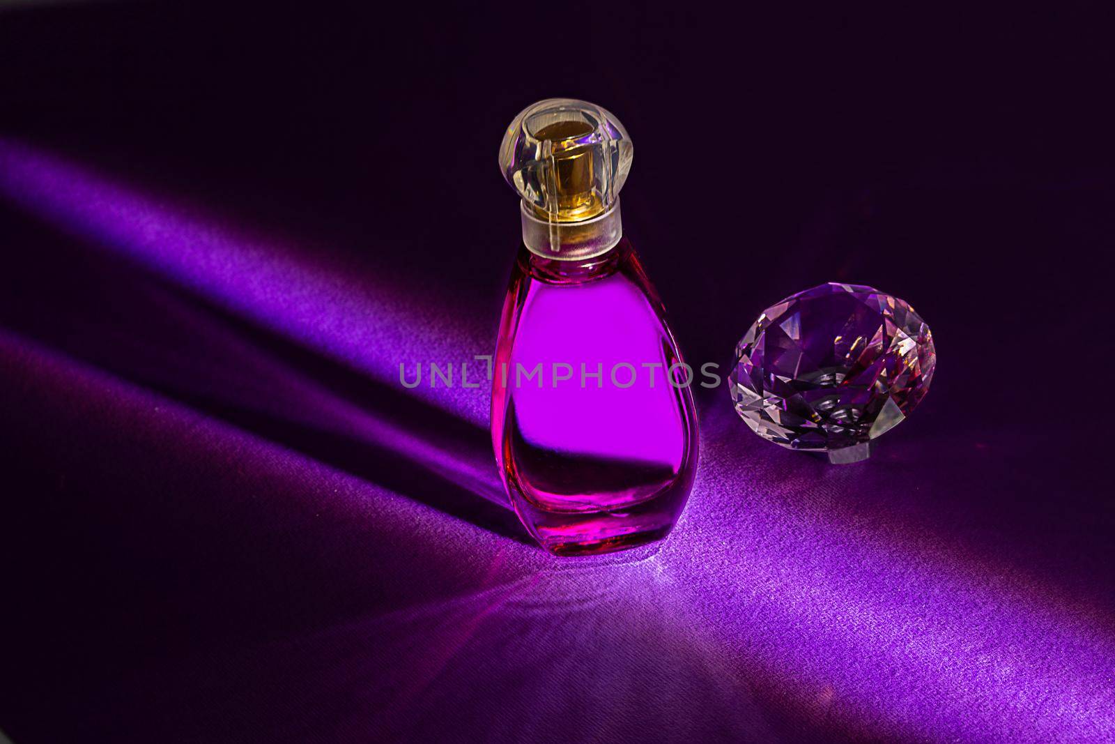 Perfume bottles studio shot on colored background with reflection by galinasharapova