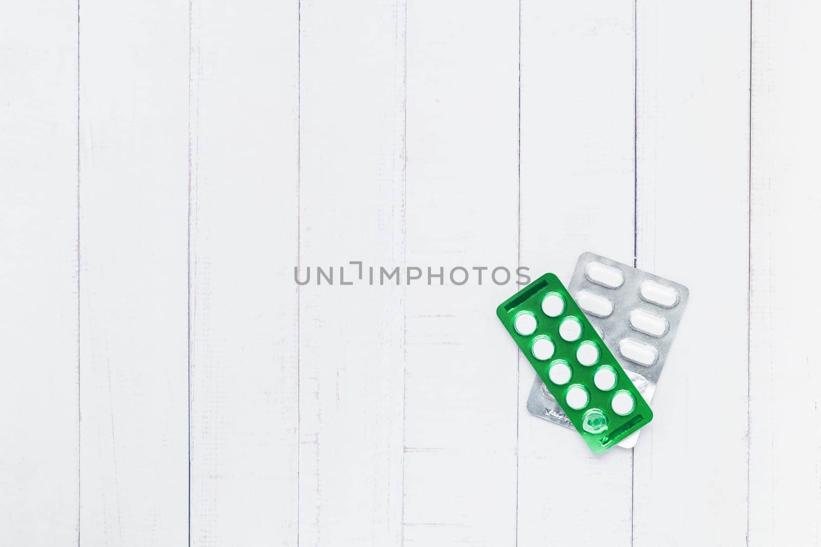 Flat lay of blister pack of medicine pill on white table background for medical and healthcare concept