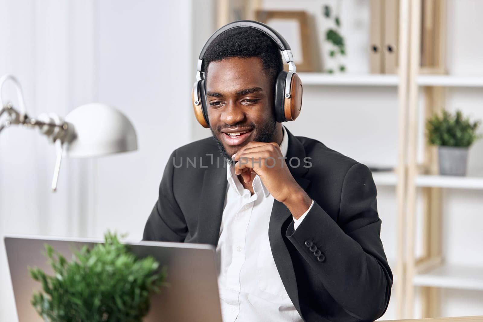 man lesson african african-american office internet distance video earphones webinar laptop education class training indoor student american zoom black laptop study call computer work