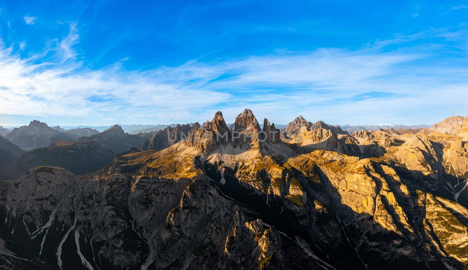 Sunset light illuminat peaks of Tre Cime di Lavaredo